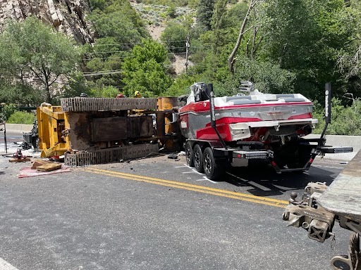 HT2. Utah dad and daughter killed in freak accident, bulldozer flies off tow truck, crushes car